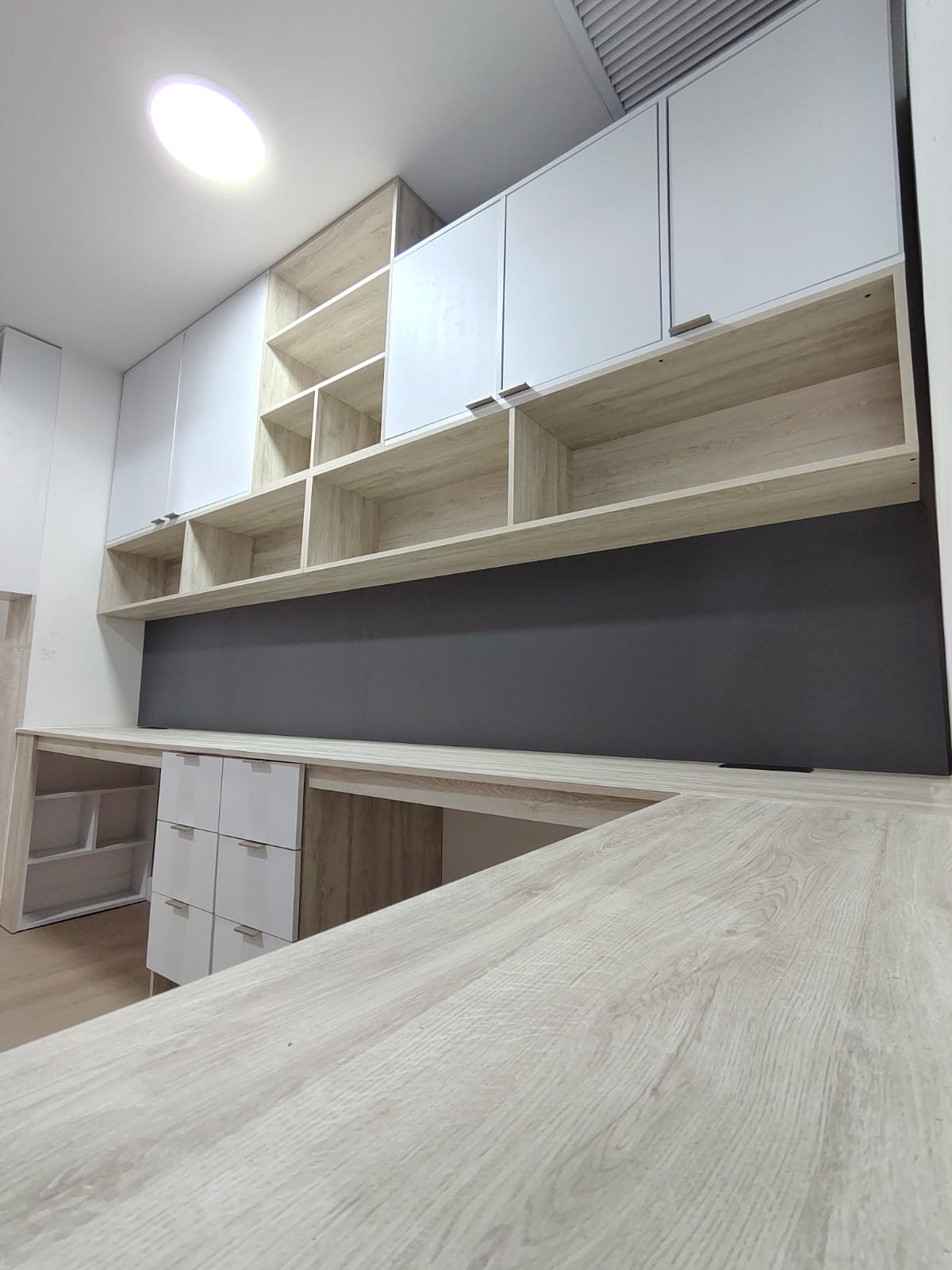 custom built-in workspace — desk and drawers, angled view